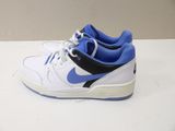 a pair of white and blue sneakers on a table