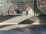 a close up of a car dashboard with various gauges