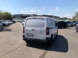 a white van that is parked in a parking lot