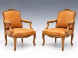 pair of louis ii style carved leather armchairs