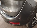 a close up of a car ' s rear end with the door open
