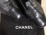 chanel black leather slippers with logo on the sole