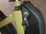 a bike with a suitcase on the back of it