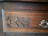 a close up of a wooden drawer with a lock on it