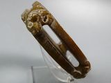 an image of a brown bracelet with a lion head on it