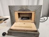 a small oven that is sitting on a table