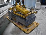 a man that is working on a machine in a factory