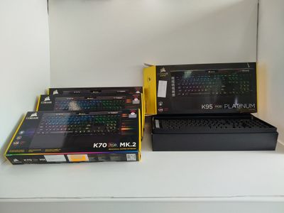 two laptops that are sitting on a shelf