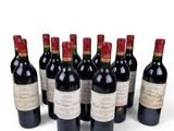 six bottles of red wine are lined up in a row