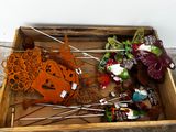 a wooden box filled with assorted items on the floor