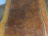 a brown rug on a wooden floor in a room