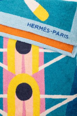 a towel that has a picture of a tennis racket on it