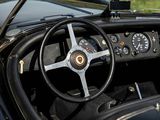 a steering wheel and dashboard of a classic sports car