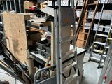 many boxes and ladders that are in a room