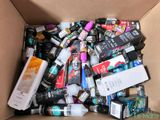 a cardboard box filled with lots of different types of toothbrushes