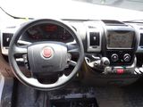 a dashboard of a car with a steering wheel and dashboard controls