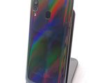 an image of a close up of a cell phone on a stand