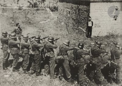 a group of soldiers that are standing in front of a building