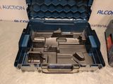 a tool kit in a blue case on a table
