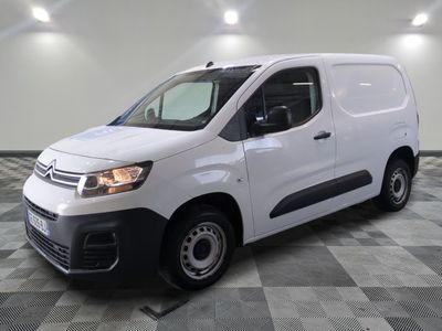 the white van is parked on a checkered tile floor
