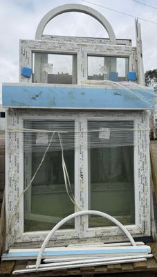 a large window that is sitting in the back of a truck