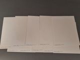 four sheets of white paper stacked on top of each other