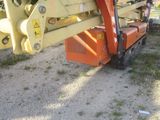 an image of a crane with a bucket attached to it ' s back