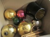 a box filled with christmas ornaments and baseball bats
