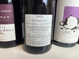 several bottles of wine are lined up on a table