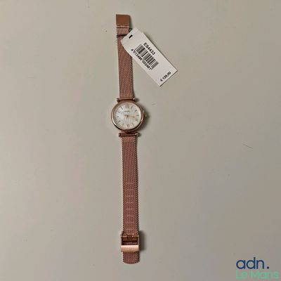 a close up of a watch on a table with a price tag