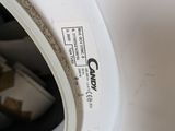 a close up of a washing machine with the door open