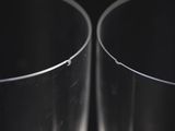 close up of a couple of glass vases sitting on top of a table