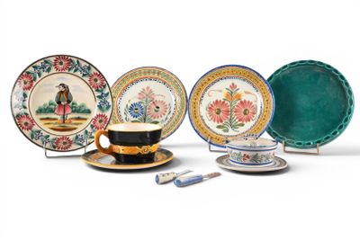 five plates and a cup on the table