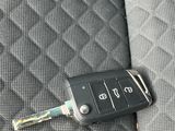 a car key sitting on the back seat of a car