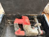 a tool in a toolbox with a hammer inside of it