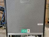 an air conditioner sitting on top of a pallet in a warehouse