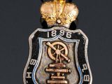 an image of a metal badge with a crown on top of it