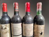 several bottles of wine are lined up on a table