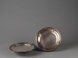 pair of silverplated dishes on stands, with a silver plate in the middle