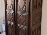 an image of a wooden armoire in a living room