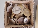 a box full of coins and a book on a table
