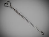 an image of a silver spoon on a gray background