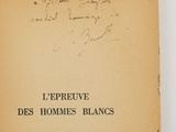 an old book with writing on it on a table