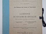 an old book with a blue ribbon on top of it