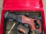 a red tool box with tools in it on the floor
