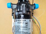 a close up of a water pump with wires attached to it