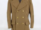 a brown peale coat on a mannequin mannequin mannequin mannequin mannequin mannequin mannequin mannequin mann
