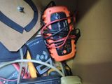 a box filled with electronics and wires and a cell phone