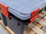 a large plastic box with a lid on a pallet