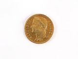 a gold coin with a picture of a man on it